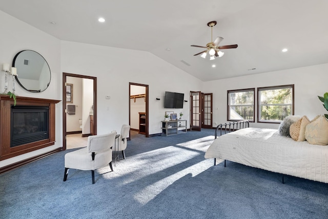 bedroom with lofted ceiling, visible vents, baseboards, a glass covered fireplace, and carpet flooring