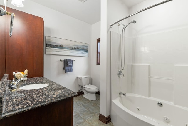 full bathroom featuring toilet, vanity, a combined bath / shower with jetted tub, and baseboards