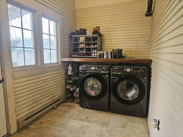 303 N Vernon St, Deer Park, WA 99006 - washroom featuring a baseboard radiator, wooden walls, washer and dryer, and laundry area
