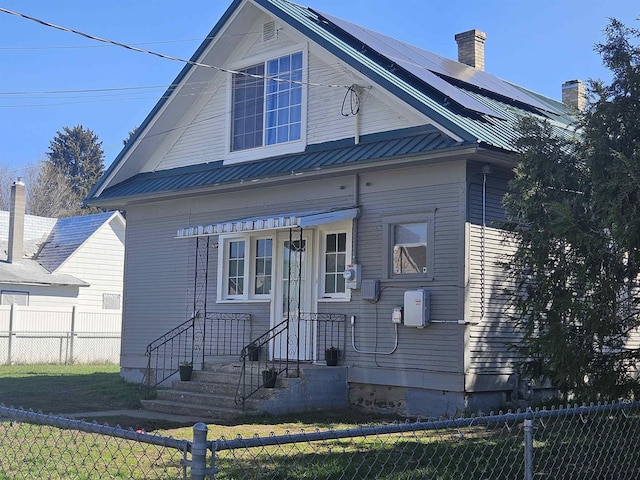 303 N Vernon St, Deer Park, WA 99006 - bungalow-style house with fence private yard, a chimney, and metal roof