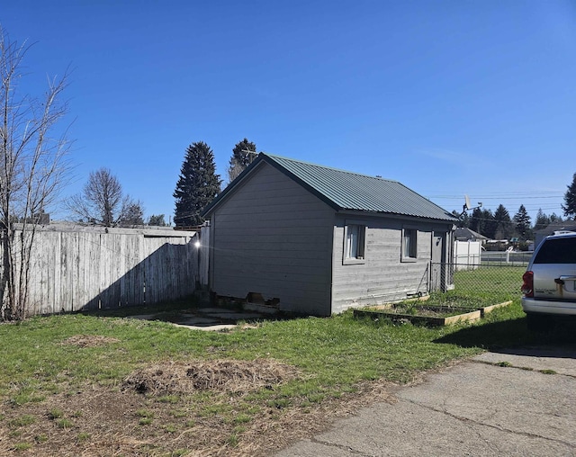 303 N Vernon St, Deer Park, WA 99006 - view of property exterior featuring a lawn, fence, and metal roof