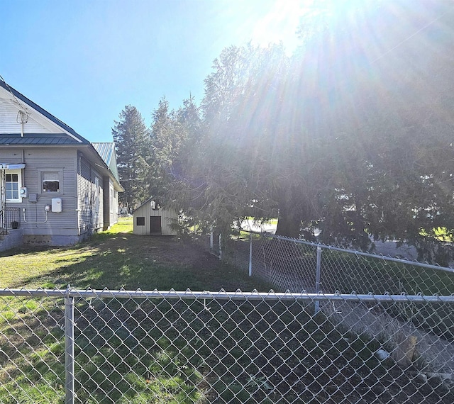 303 N Vernon St, Deer Park, WA 99006 - view of yard featuring an outdoor structure and fence