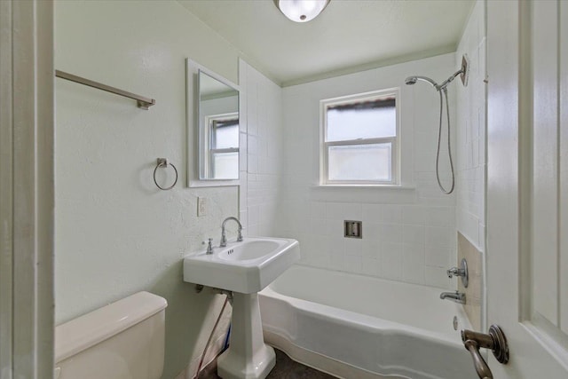 bathroom featuring toilet and  shower combination