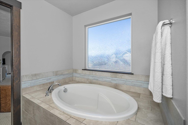 bathroom with a garden tub