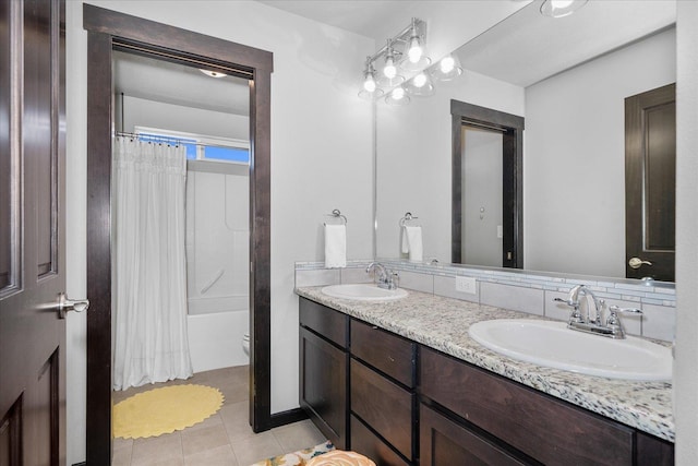 full bath featuring tile patterned flooring, shower / bath combination with curtain, a sink, and double vanity