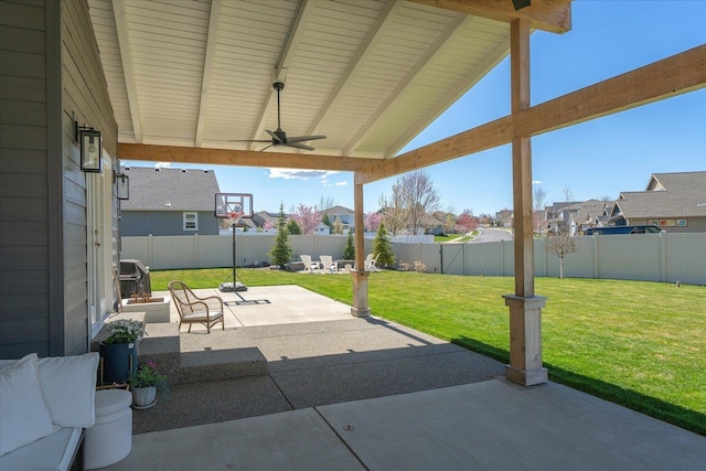 view of patio with a residential view, a ceiling fan, area for grilling, and a fenced backyard