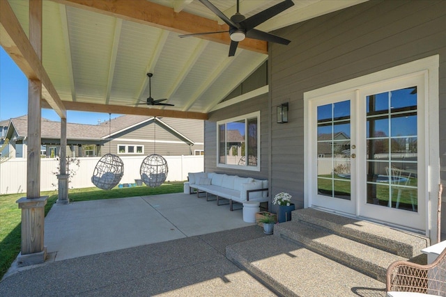 view of patio / terrace featuring entry steps, a ceiling fan, and fence