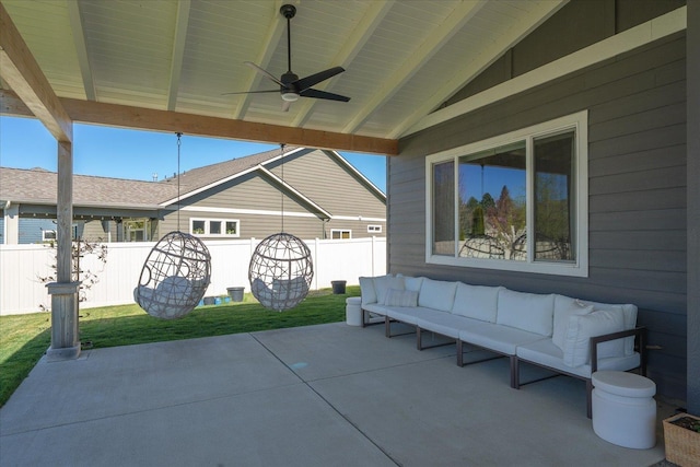view of patio with fence, an outdoor living space, and ceiling fan