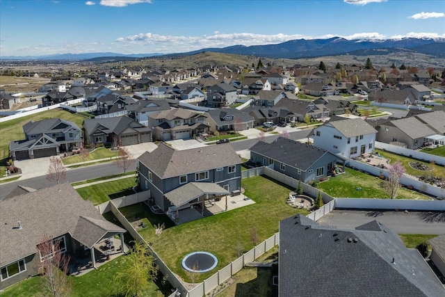 birds eye view of property featuring a mountain view and a residential view