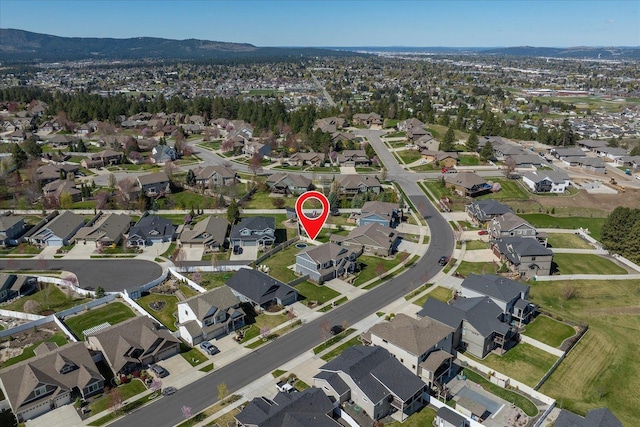 bird's eye view with a residential view and a mountain view
