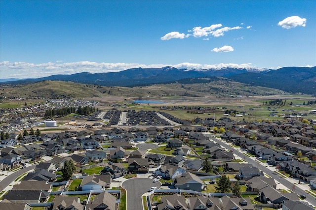 birds eye view of property with a residential view and a mountain view