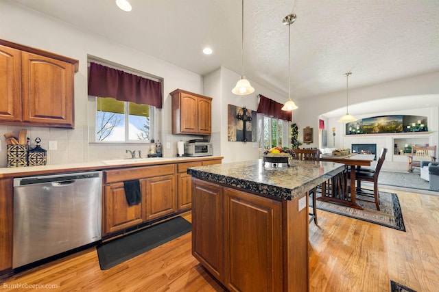 17202 E Morningside Ln, Greenacres, WA 99037 - kitchen with dishwasher, a wealth of natural light, tasteful backsplash, and light wood finished floors