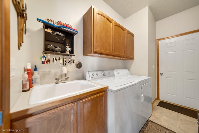 17202 E Morningside Ln, Greenacres, WA 99037 - clothes washing area with washing machine and clothes dryer, cabinet space, and a sink