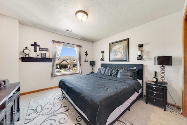 17202 E Morningside Ln, Greenacres, WA 99037 - bedroom featuring visible vents, light carpet, baseboards, and a textured ceiling