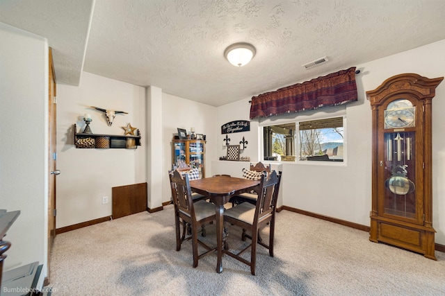 17202 E Morningside Ln, Greenacres, WA 99037 - dining space with visible vents, light carpet, baseboards, and a textured ceiling