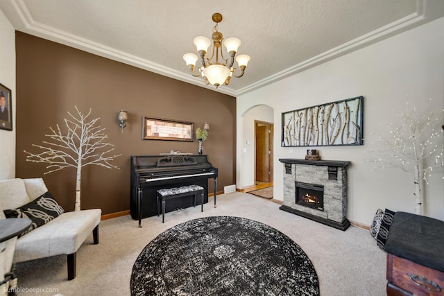 17202 E Morningside Ln, Greenacres, WA 99037 - sitting room featuring a stone fireplace, arched walkways, a chandelier, and carpet