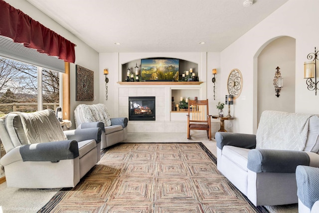 17202 E Morningside Ln, Greenacres, WA 99037 - living area with a tiled fireplace, arched walkways, and recessed lighting