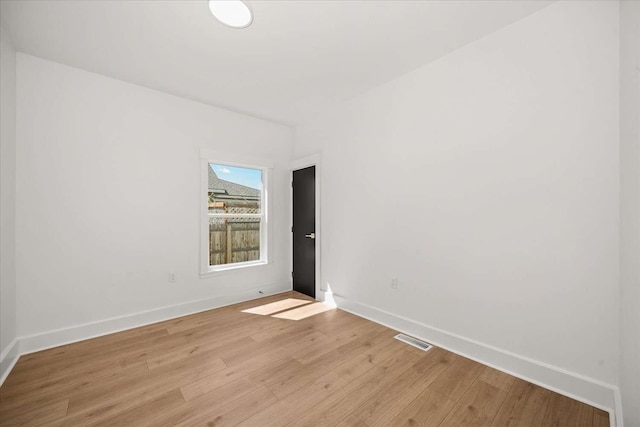 1873 E Marshall Ave, Spokane, WA 99207 - spare room featuring baseboards, light wood finished floors, and visible vents
