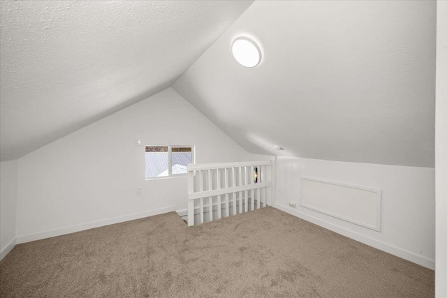 1873 E Marshall Ave, Spokane, WA 99207 - bonus room featuring vaulted ceiling, carpet flooring, a textured ceiling, and baseboards