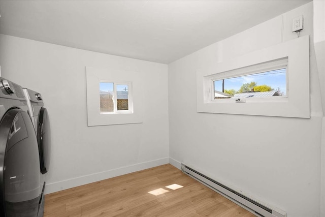 1873 E Marshall Ave, Spokane, WA 99207 - laundry area with laundry area, independent washer and dryer, light wood-style floors, baseboards, and baseboard heating