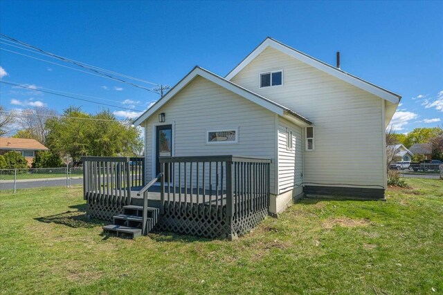 1873 E Marshall Ave, Spokane, WA 99207 - rear view of property featuring fence, a yard, and a deck