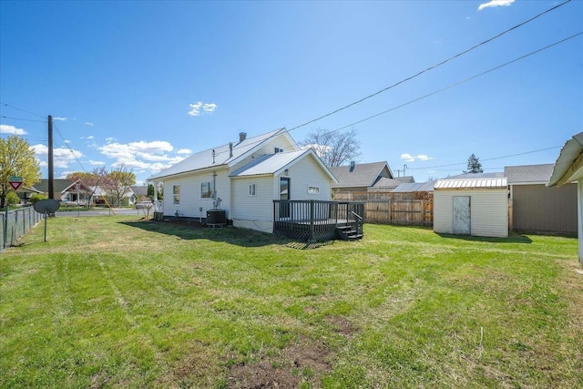 1873 E Marshall Ave, Spokane, WA 99207 - view of yard with a fenced backyard, an outbuilding, a shed, and a deck
