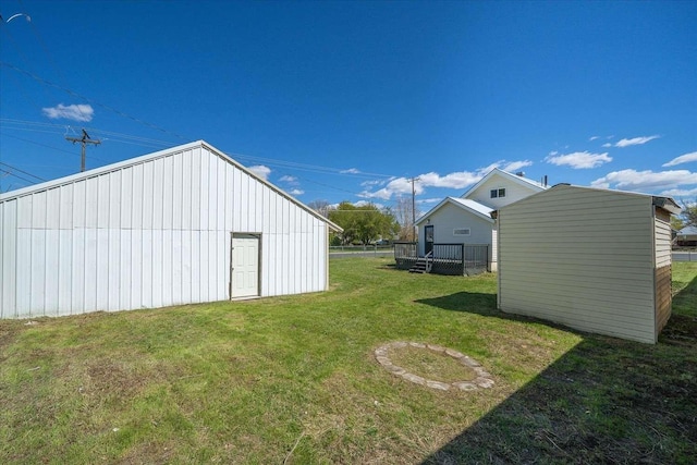 1873 E Marshall Ave, Spokane, WA 99207 - view of yard featuring an outdoor structure and fence