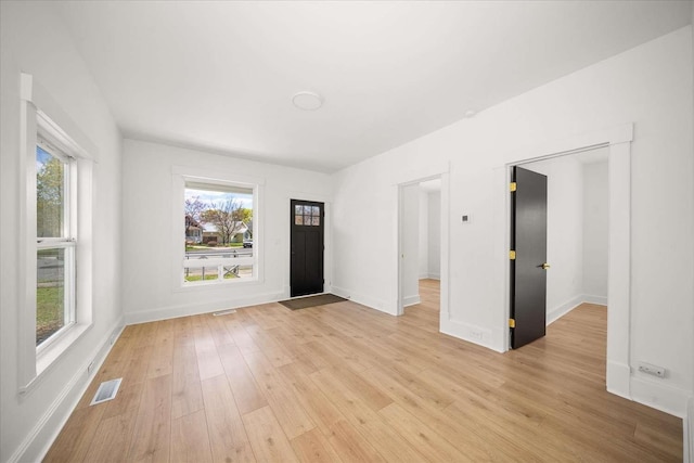 1873 E Marshall Ave, Spokane, WA 99207 - spare room featuring baseboards, visible vents, and light wood-type flooring