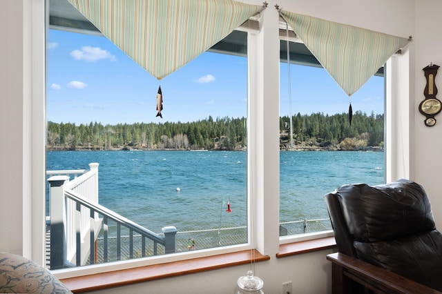 property view of water with a forest view