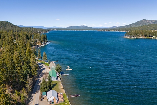 aerial view featuring a water and mountain view