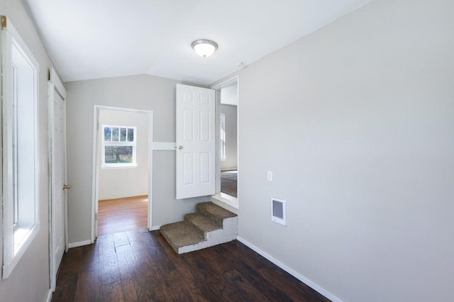 8323 W Mission Ave, Spokane, WA 99224 - unfurnished bedroom with baseboards, vaulted ceiling, visible vents, and dark wood-style floors