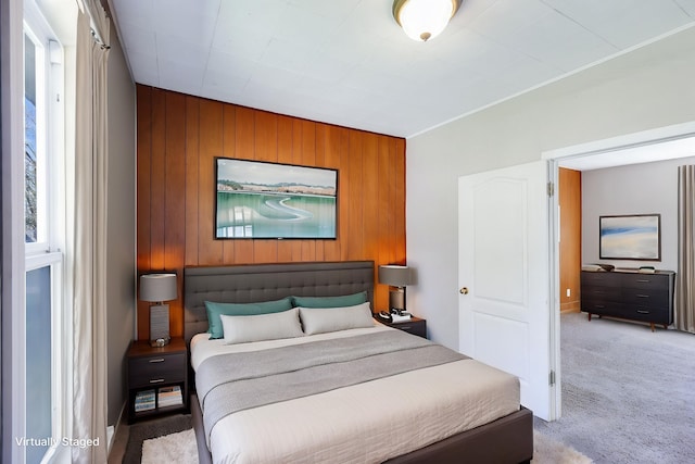 8323 W Mission Ave, Spokane, WA 99224 - bedroom featuring an accent wall, wooden walls, and carpet