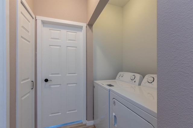 washroom featuring washing machine and clothes dryer