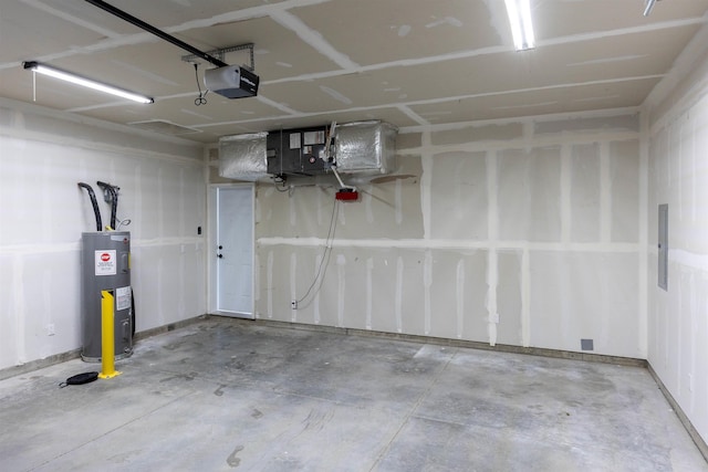 garage with a garage door opener and electric water heater