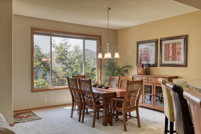 1511 N Lancashire Ln, Liberty Lake, WA 99019 - dining area with a chandelier, baseboards, and light carpet