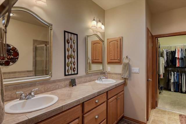 1511 N Lancashire Ln, Liberty Lake, WA 99019 - full bathroom featuring double vanity, a shower stall, a spacious closet, and a sink