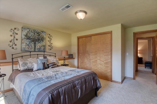 1511 N Lancashire Ln, Liberty Lake, WA 99019 - bedroom with light colored carpet, baseboards, visible vents, and a closet
