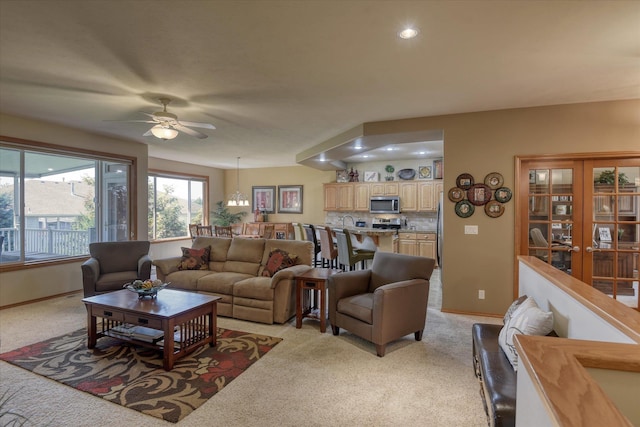 1511 N Lancashire Ln, Liberty Lake, WA 99019 - living room with ceiling fan with notable chandelier, light carpet, baseboards, and recessed lighting