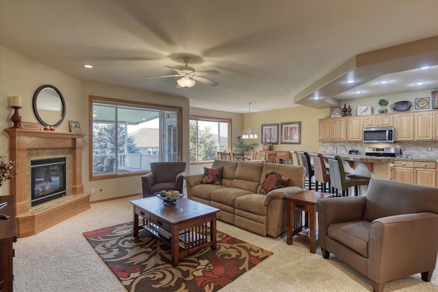 1511 N Lancashire Ln, Liberty Lake, WA 99019 - living area with a ceiling fan, a high end fireplace, recessed lighting, and light colored carpet