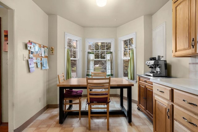dining space featuring baseboards