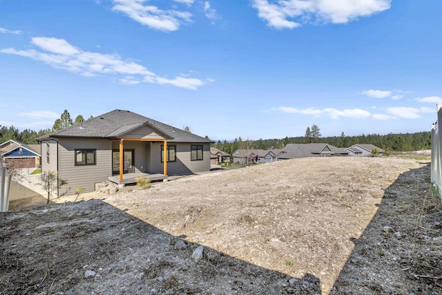 exterior space with a shingled roof