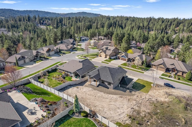 aerial view featuring a residential view and a forest view