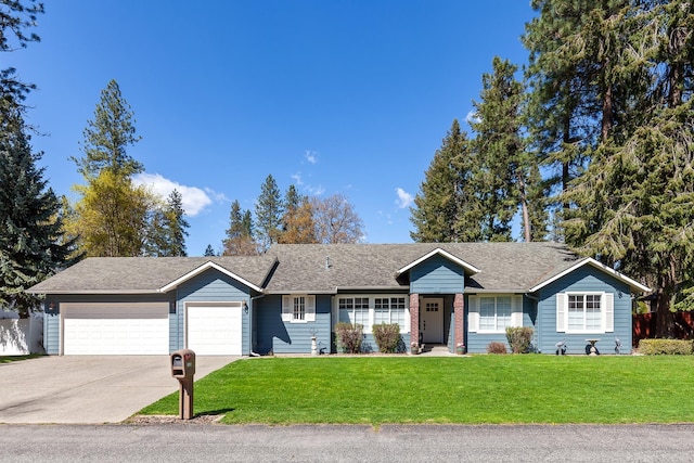 1633 E Northwood Dr, Hayden, ID 83835 - ranch-style home featuring driveway, a shingled roof, a front lawn, and a garage