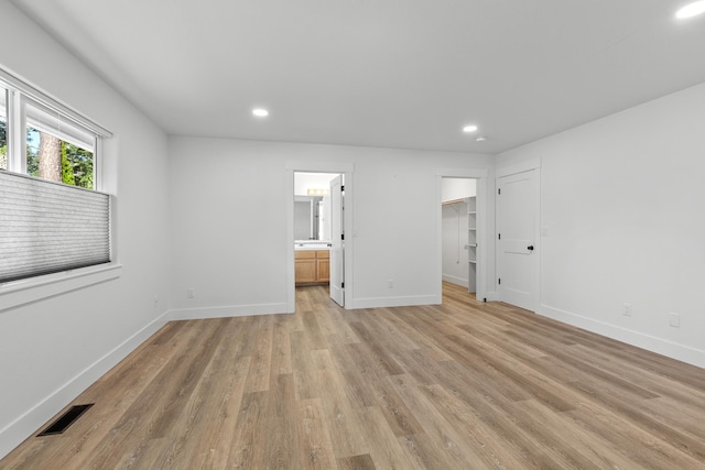 1633 E Northwood Dr, Hayden, ID 83835 - unfurnished bedroom with recessed lighting, visible vents, and light wood-type flooring