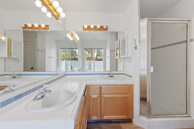 1633 E Northwood Dr, Hayden, ID 83835 - bathroom featuring double vanity, a sink, and a stall shower