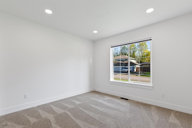 1633 E Northwood Dr, Hayden, ID 83835 - spare room featuring baseboards, carpet flooring, recessed lighting, and visible vents