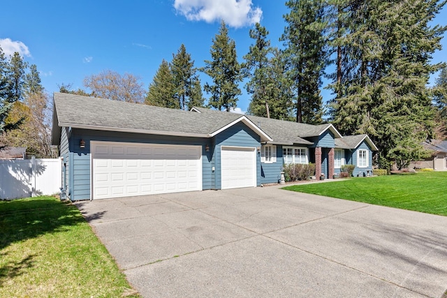 1633 E Northwood Dr, Hayden, ID 83835 - single story home featuring fence, an attached garage, driveway, and a front yard