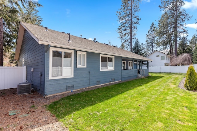 1633 E Northwood Dr, Hayden, ID 83835 - back of house featuring central AC unit, fence, and a yard