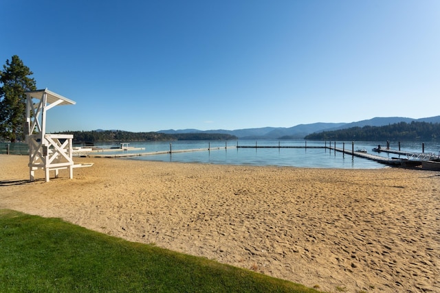 1633 E Northwood Dr, Hayden, ID 83835 - property view of water featuring a boat dock and a mountain view