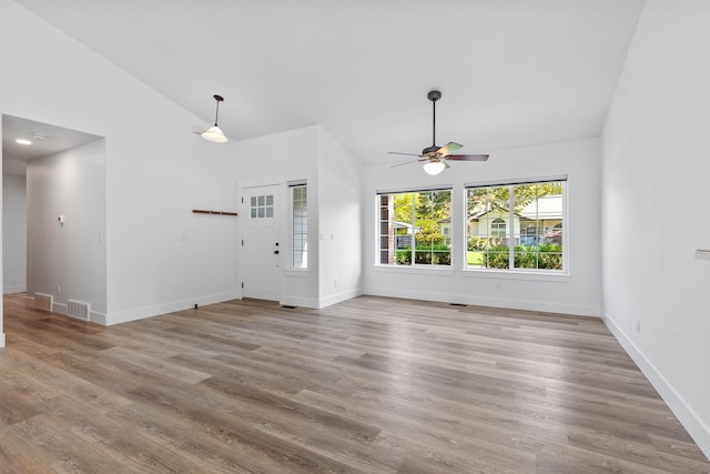 1633 E Northwood Dr, Hayden, ID 83835 - unfurnished living room with baseboards, a ceiling fan, wood finished floors, and visible vents